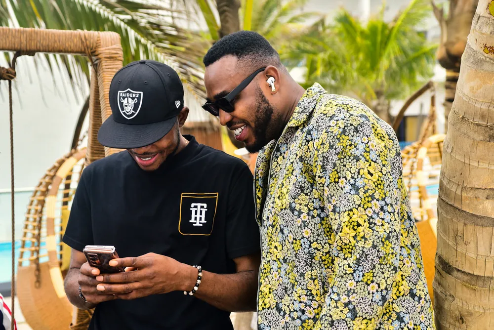 Two friends looking at a phone together